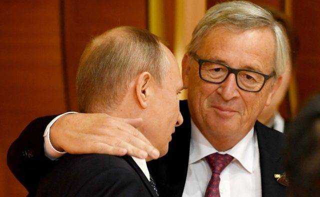 Зачем Юнкер поцеловал Путина