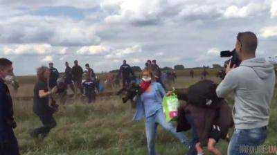 Скандал в Венгрии: уволена журналистка за подножку мигранту с ребенком. Видео